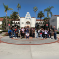 School group taking a photo in front of SDSU's iconic Hepner Hall