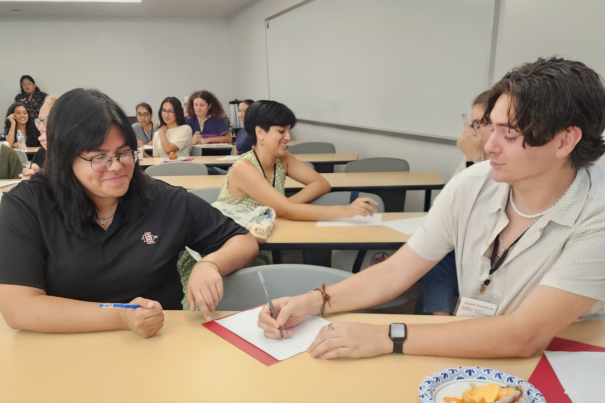 Student writing in notepad